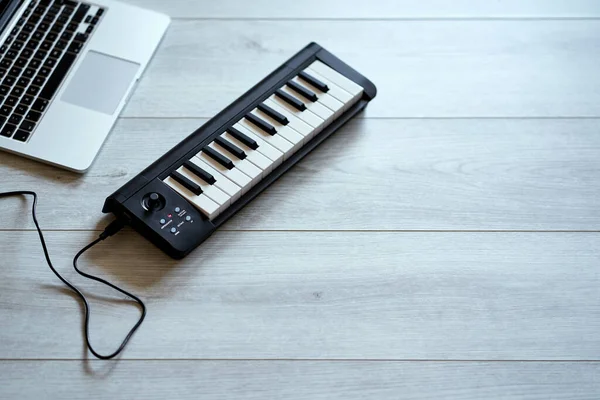 keyboard musical instrument on a white floor