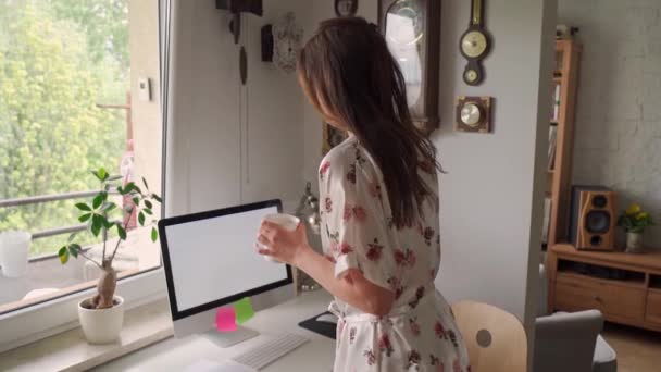 Woman in pajamas working remotely at home during a pandemic in slow motion — Stock Video