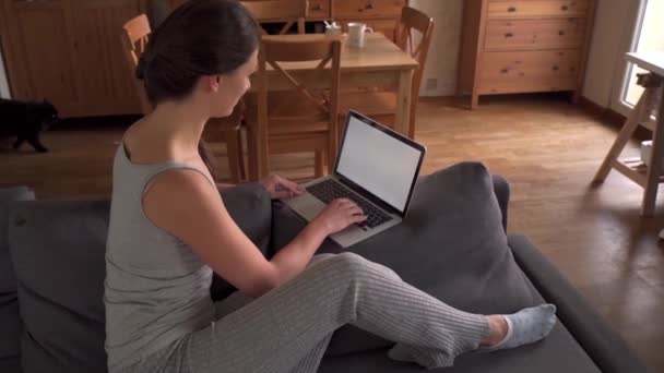 Woman in pajamas working from home during a pandemic in slow motion — Stock Video