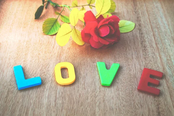 Love concepts on wooden background — Stock Photo, Image