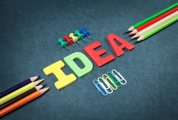 Colorful word idea with push pins and paper clips. — Stock Photo, Image