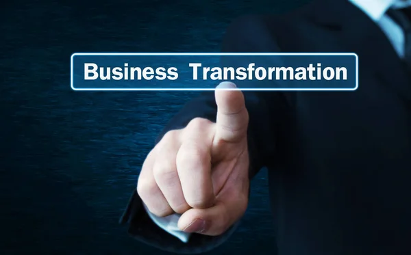 Man hand pressing on Business Transformation text on screen. — Stock Photo, Image