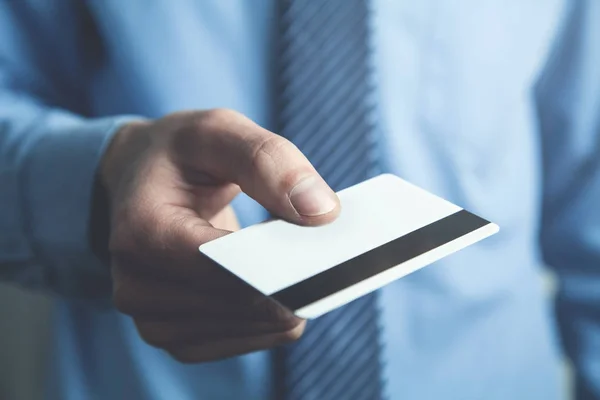 stock image Businessman showing credit card.