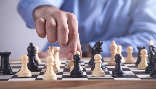 Man playing chess. Play with God or with yourself. Concept - strategy  goals, efforts, plans. Stock Photo