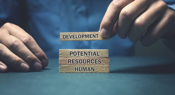 Human resources text on wooden block. Business concept