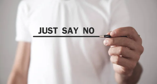 Man writing Just Say No in screen.