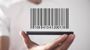Barkod gösteren bir iş adamı. Depo, lojistik ve finansal konsept