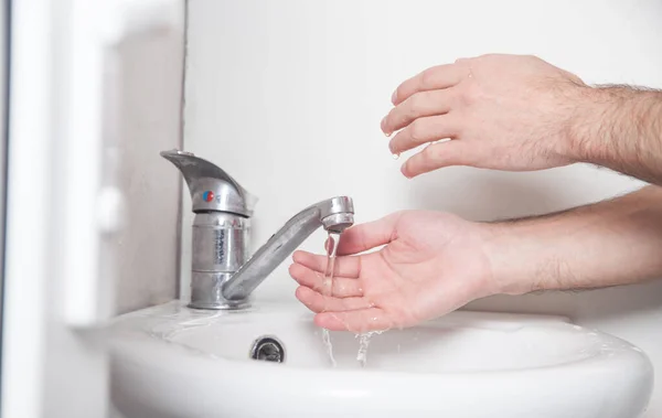 Man cleaning hands. Hygiene. Washing hands