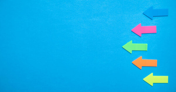 Colorful arrows on blue background.