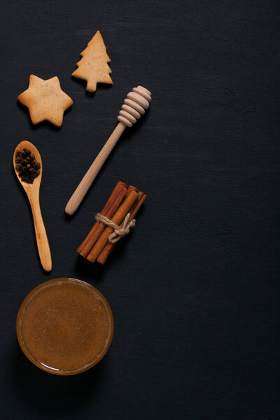 Baking background with cookies, honey, spices and spoons.