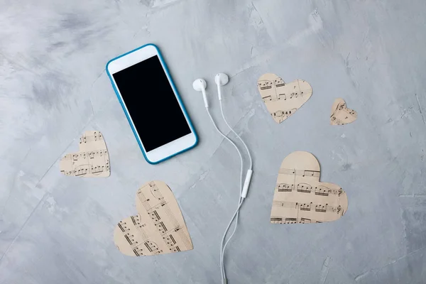 Flatlay müzik kompozisyon akıllı telefon veya cep telefonu, kağıt duymak