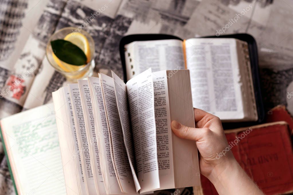 Girl holding a Bible.