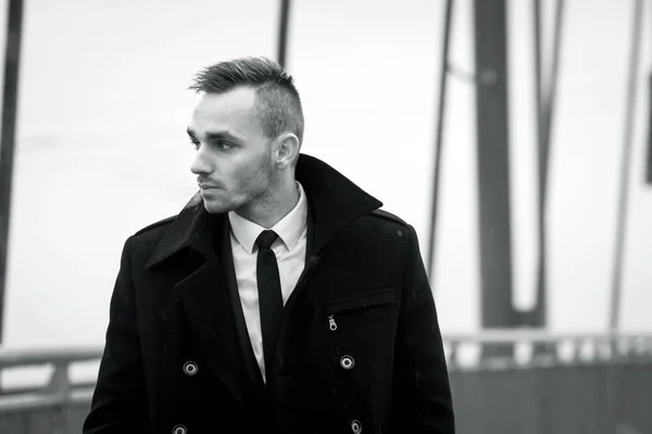 Portrait of young handsome stylish man in elegant coat. — Stock Photo, Image