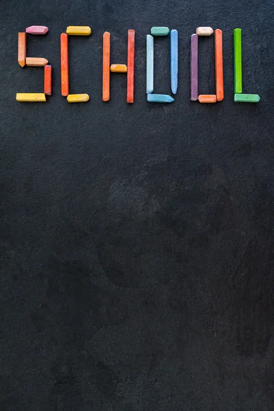 Text "School" created with oil pastels on slate — Stock Photo, Image