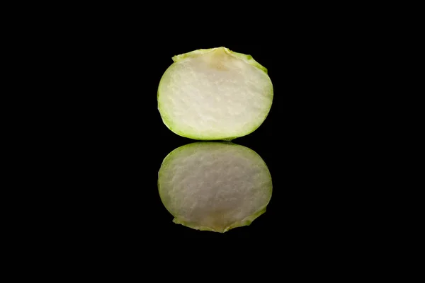 Cut in half green kohlrabi isolated on black background — Stock Photo, Image