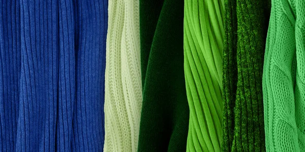 Best warm green colors matching for classic blue. Fashion color trends for year 2020. Knitted clothes fabric samples.