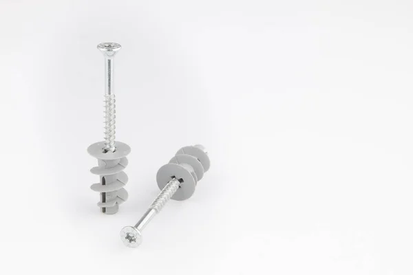 Dowel pin or wall plugs and screws for gypsum board