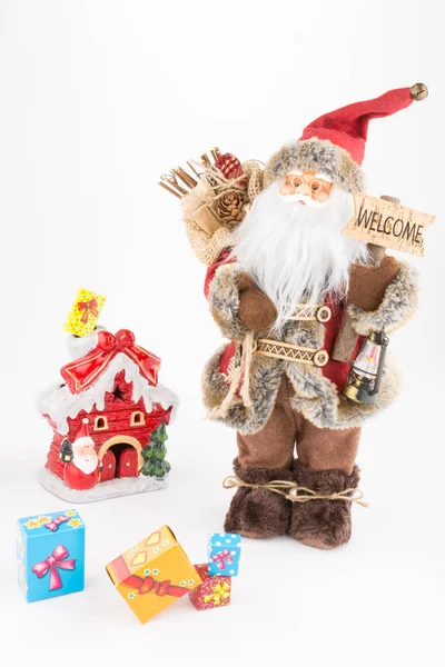 Muñeca de Santa Claus vintage, decoración pequeña casa y cajas de regalo — Foto de Stock