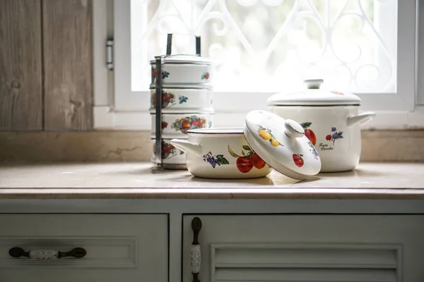 Vintage cooking pot and tiffin carrier set on the kitchen table — Stock Photo, Image