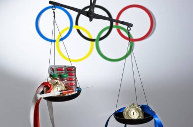 Spor kavram doping. Uyuşturucu ve siyah arka plan üzerine madalya.