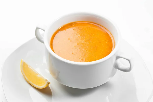 Turkish mercimek corbasi. Turkish lentil soup with a slice of lemon. — Stock Image Turkish mercimek corbasi. Turkish lentil soup with a slice of lemon. Royalty Free Stock Photos