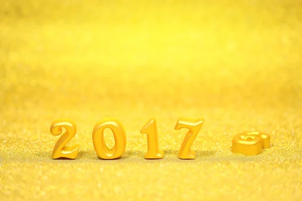 2017 real 3d objects on gold glitter background, happy new year concept — Stock Photo, Image