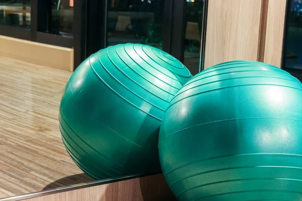 Yoga ball in fitness room with mirror reflection, fitness concept