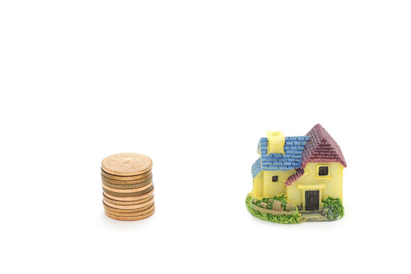 Isolated coin money and home on white background 