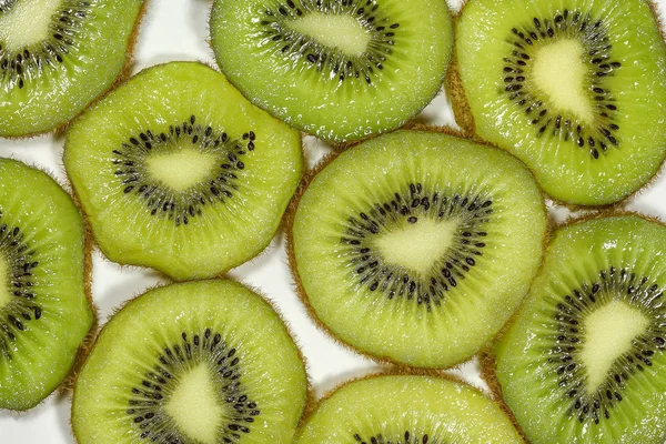 Close-up van bovenaanzicht macro kiwi fruit segmenten voor achtergrond — Stockfoto