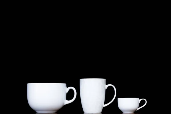 Three white cups with different shapes — Stock Photo, Image