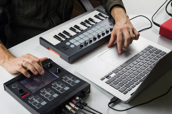 Producing electronic music on laptop with portable midi keyboard and electronic effect processors