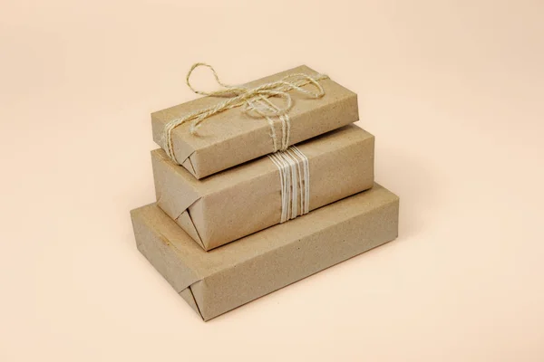 Presents in wrapped in recycled paper, copy space. — Stock Photo, Image