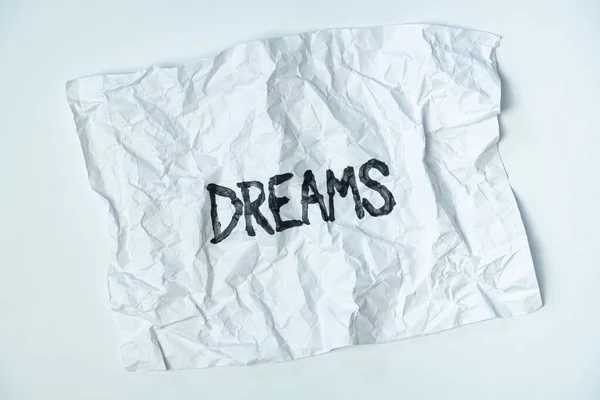 折り畳まれた紙の上のビューに手書き サイン 壊れた夢や失敗した夢の概念 抽象的なイラストのイメージ — ストック写真