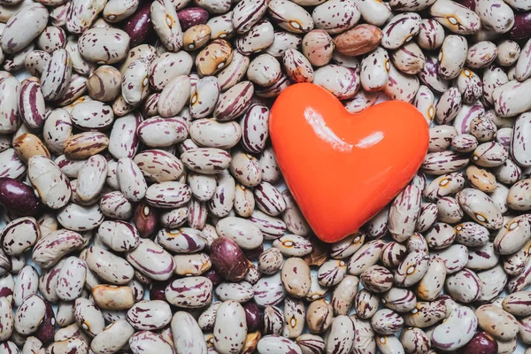 Heart shape on a heap of beans