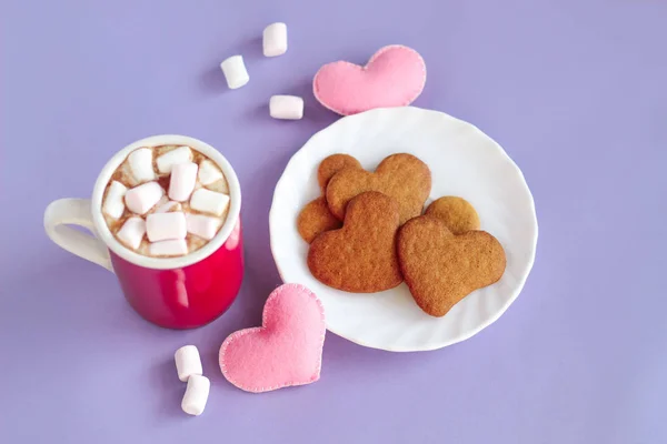 mug of chocolate with heart gingerbread cookies