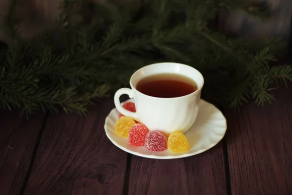 Berry marmalades, tea on dark wooden background — Stock Photo, Image