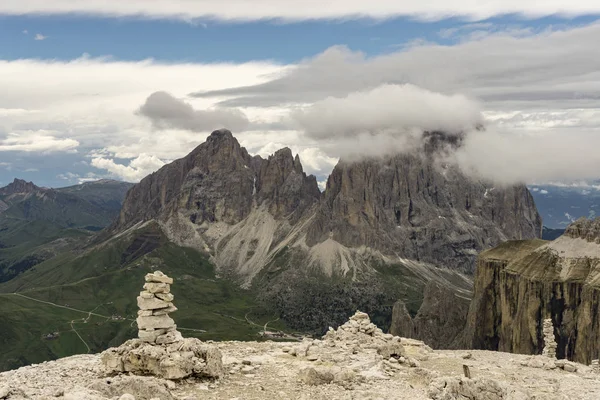 Sassolungo peaks among the clouds. Dolomites. Italy. — Stock Photo, Image