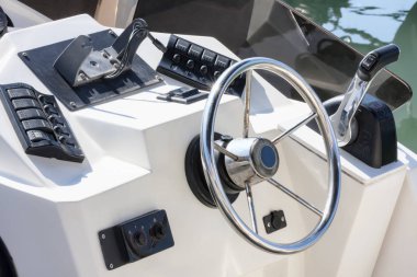 Well equipped dashboard in fishing boat clipart