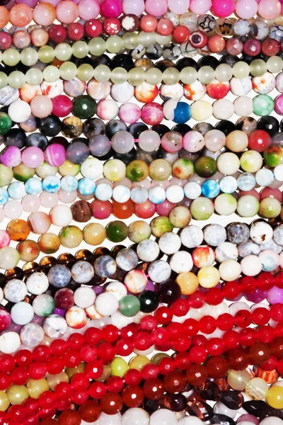 Many necklaces in plastic beads — Stock Photo, Image