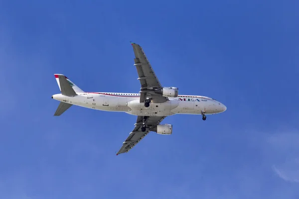 Fiumicino;Italy December 17; 2017: Beautiful airplane of Middle East Airlines model Airbus a320 ready to landing in Fiumicino International Airport in a Rome s sunny day.