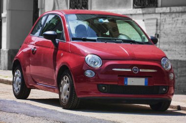 Turin,Italy - May 09, 2014: Red model of urban car Fiat 500 from Italian Fiat automaker parked on the street