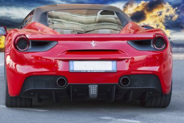 Rome, Italy - June 24, 2018: Rear view of luxury model red sports car Ferrari 488 GTB The Ferrari 488 is an Italian sports supercar produced since 2015 by Ferrari automotive,its  powered by a 3.9 litre twin turbocharged V8.