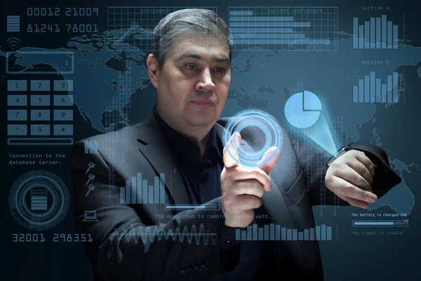 The businessman works with a futuristic virtual interface