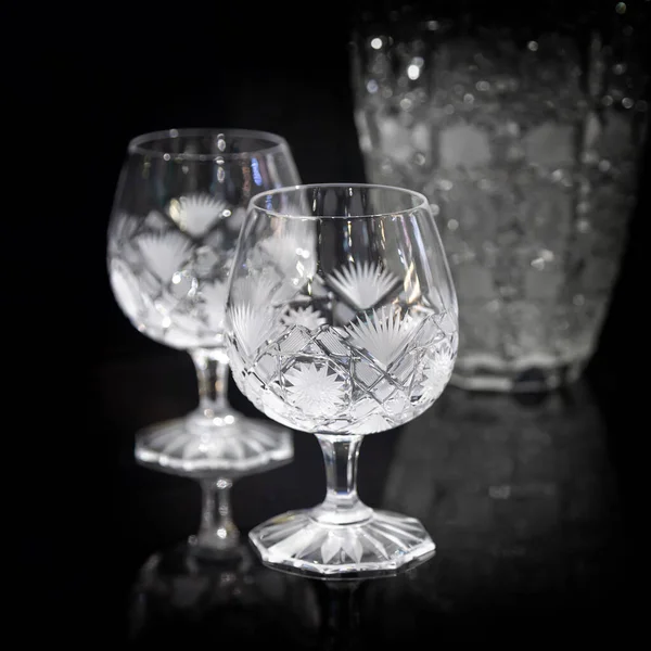 Set of crystal glasses on a dark background, crystal glassware for wine