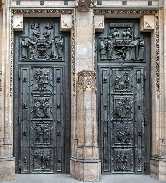 Old iron doors - entrance to the medieval Gothic cathedral, heavy wrought iron doors to the castle