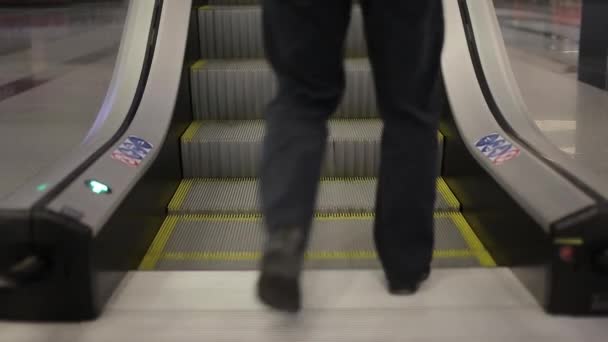 Two men climb the stairs upward — Stock Video