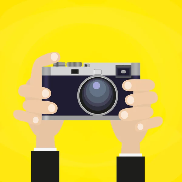 Retro fotocamera met de hand met het. — Stockvector
