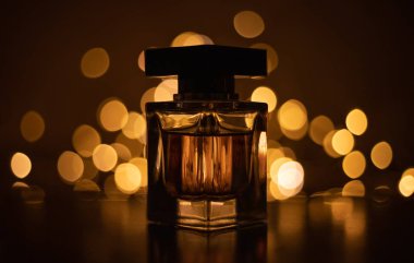 Perfume bottle on bokeh lights background