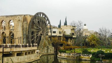 Irrigation Water-wheel norias in Hama on Orontes river Syria clipart