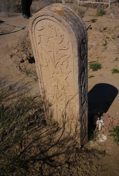Tomb stone aka Kulpytas at the cemetery of Mizdakhan, Khodjeyli,Karakalpakstan, Uzbekistan